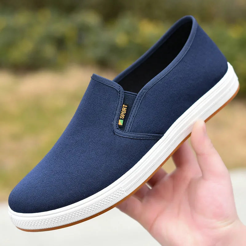 Men's black slip-on canvas cloth shoes with round toe and injection moulded sole