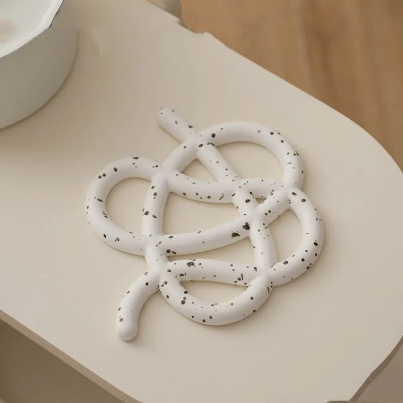 Ceramic heat proof mat in irregular shape with hook for hanging storage