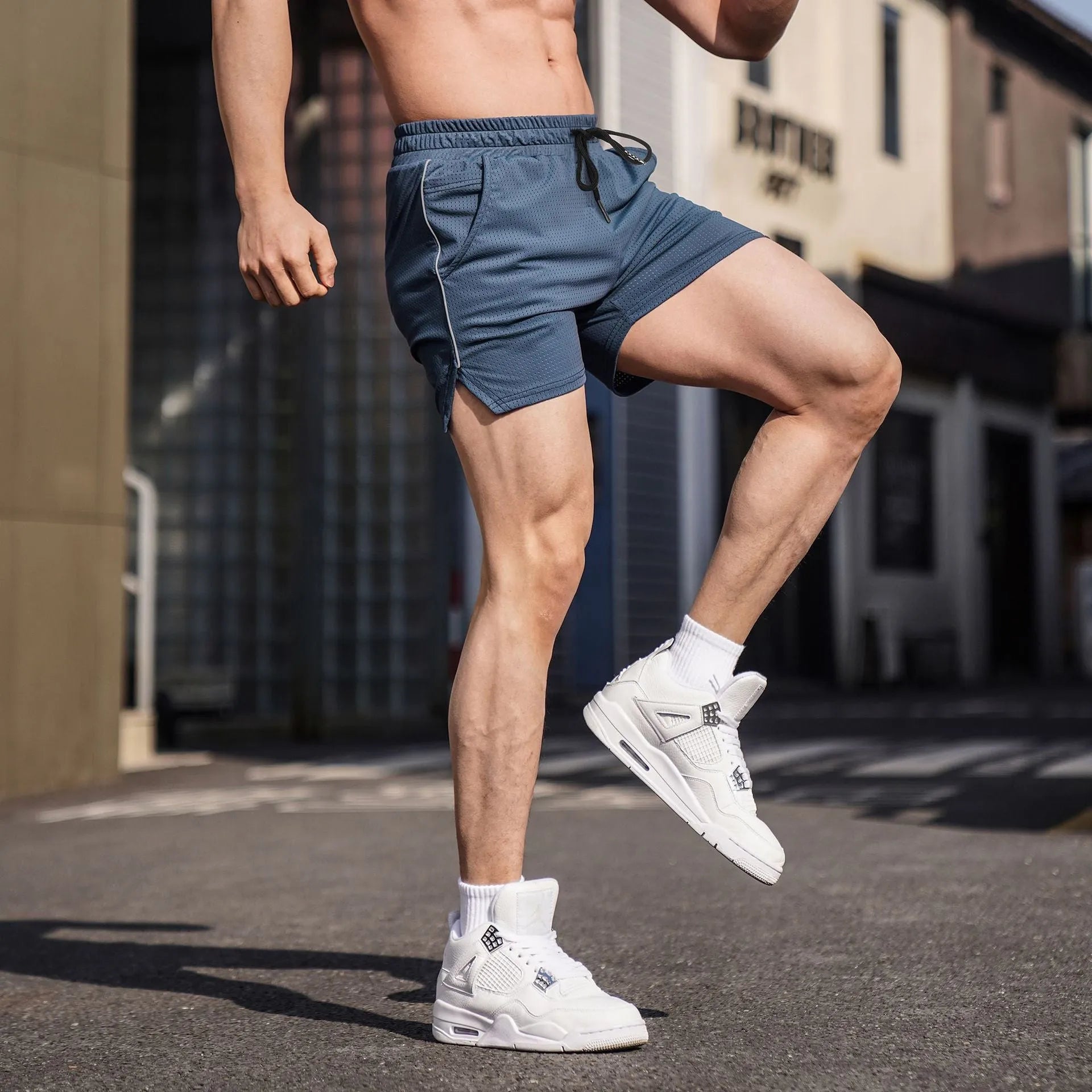 Men's straight-leg polyester sports shorts in black, available in sizes M to 3XL