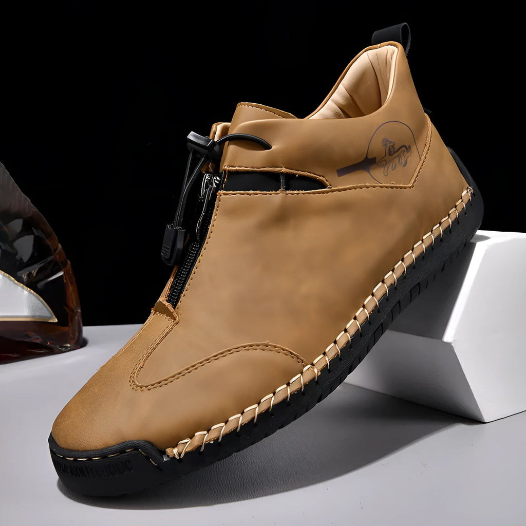 Men's black casual leather sneakers with a mid heel and round toe on a rubber sole.