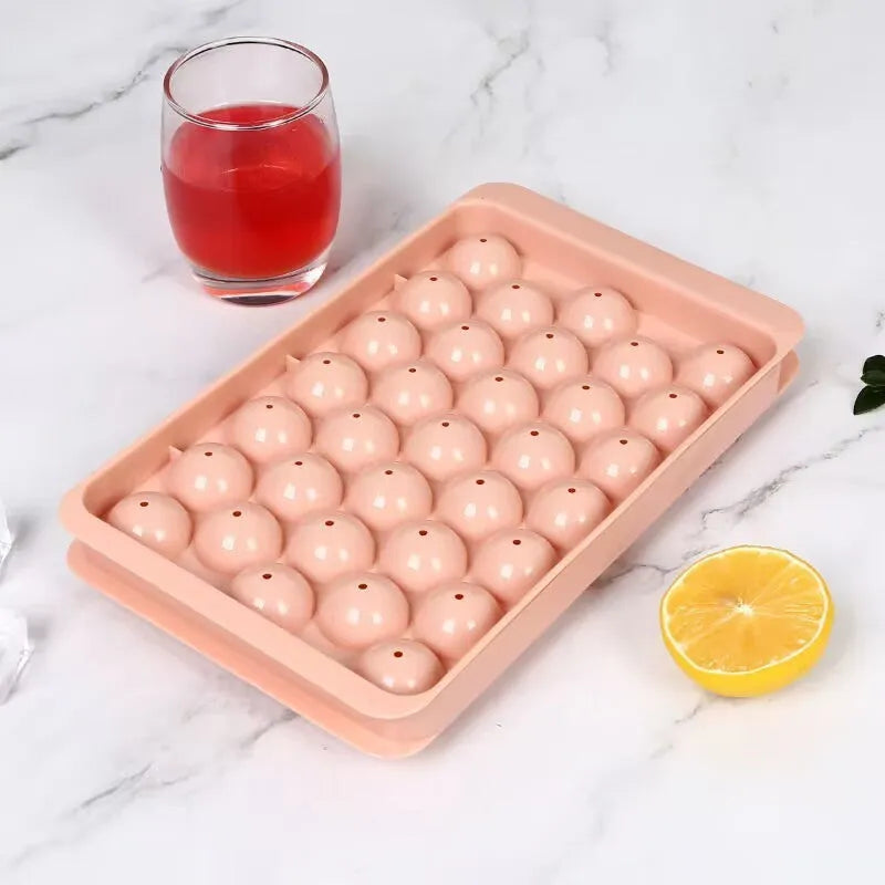33 grid round silicone ice cube tray with lid in blue or pink measuring 24x14x3cm