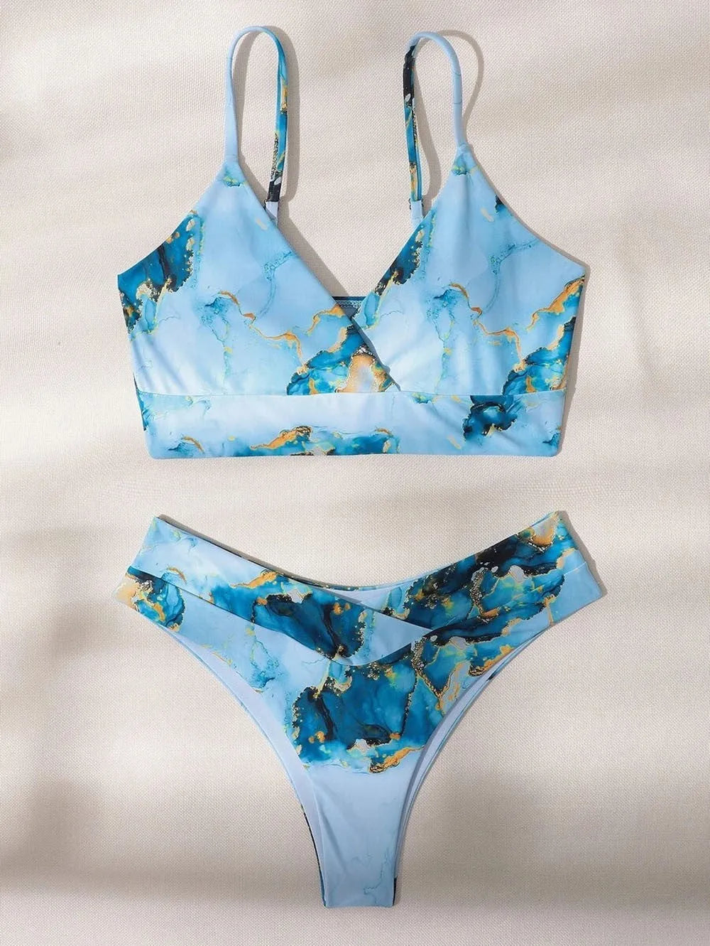 Women's high-waisted bikini set with marble tie-dye print and U-neck top