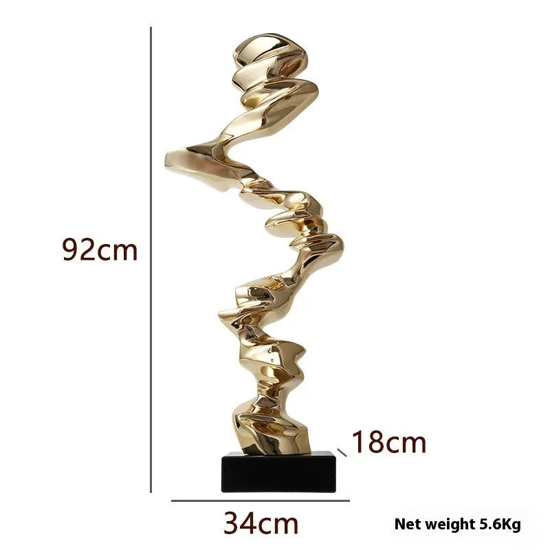 Modern abstract still life ornament in natural resin, shown in bright gold, elegant silver, and phantom blue finishes.