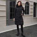 Black hooded slim fit long winter jacket for men on a hanger