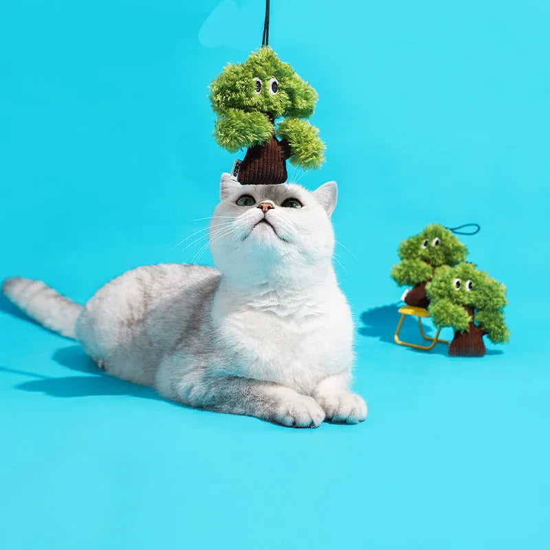 Pine wood base cat toy with fabric catnip pouch hanging from a string.