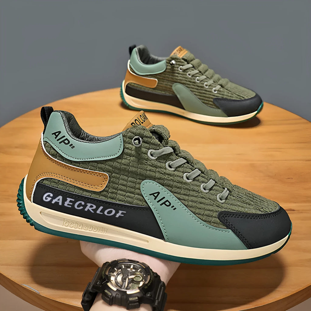 Men's grey and green mesh running shoes with low-top design and lace-up closure