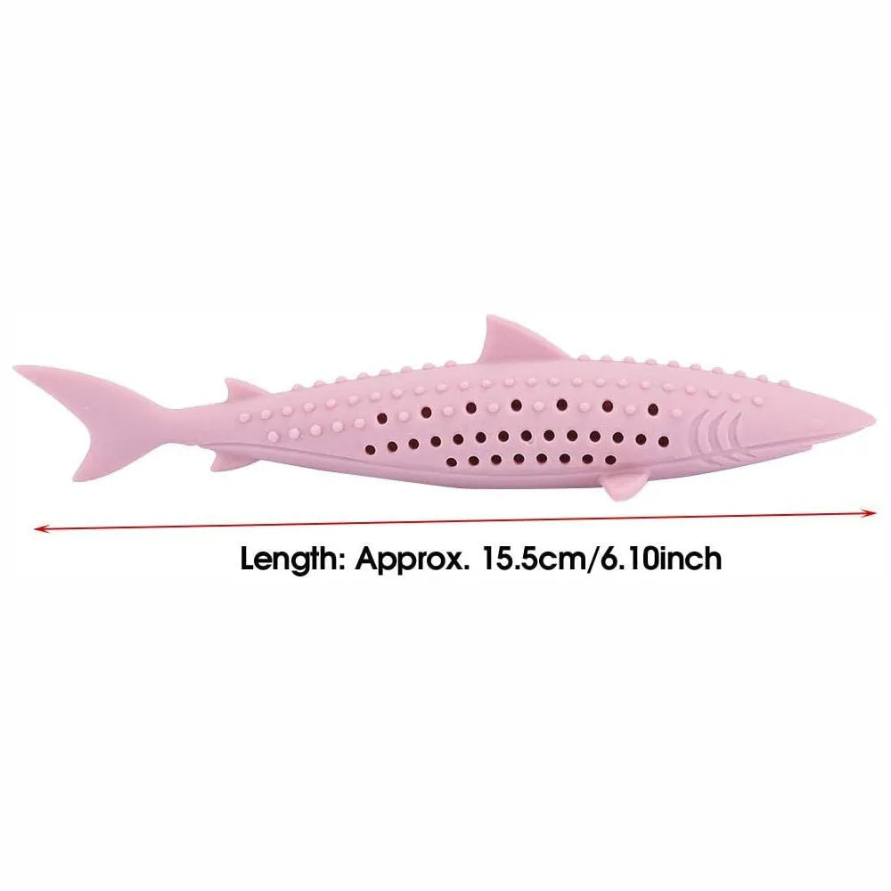 Green silicone fish-shaped cat chew toy with dental cleaning texture and side holes