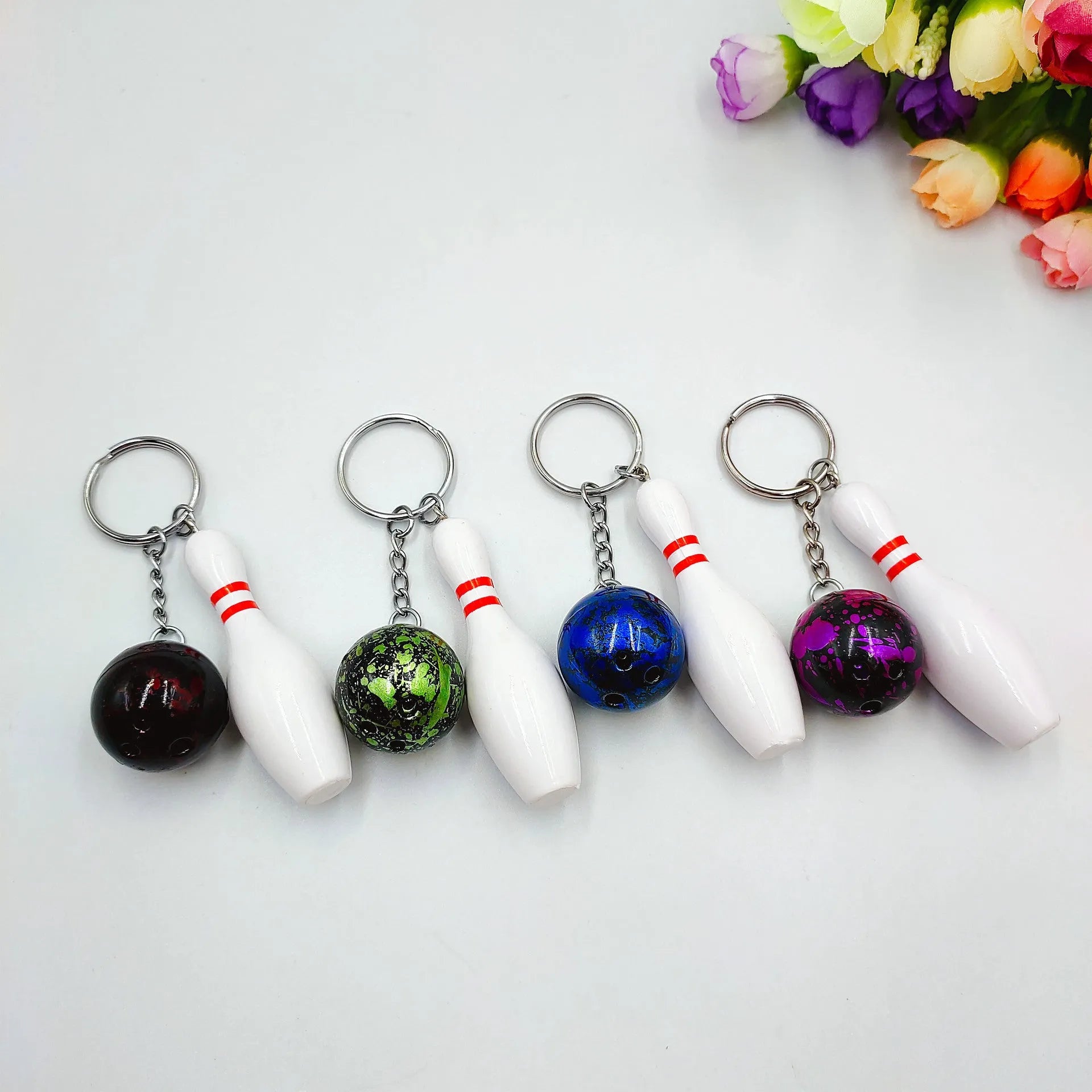 Miniature bowling ball keychain pendant in choice of four colours with key ring attachment