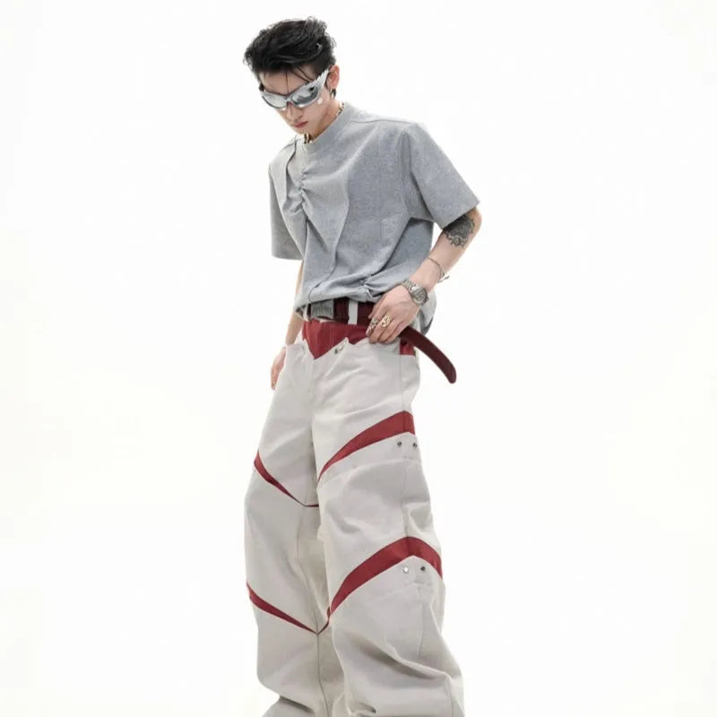 Men's loose grey cotton T-shirt with three-dimensional pleating detail on the front.