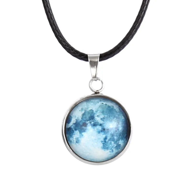 Luminous moon and constellation pendant necklace on a chain with an extension, shown in one of ten possible colours.