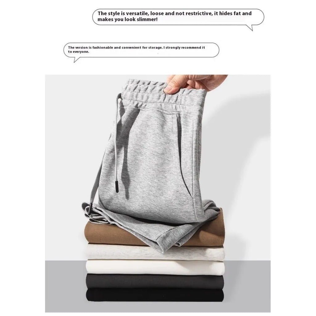 Men's straight leg cotton sports shorts in light grey on a hanger.