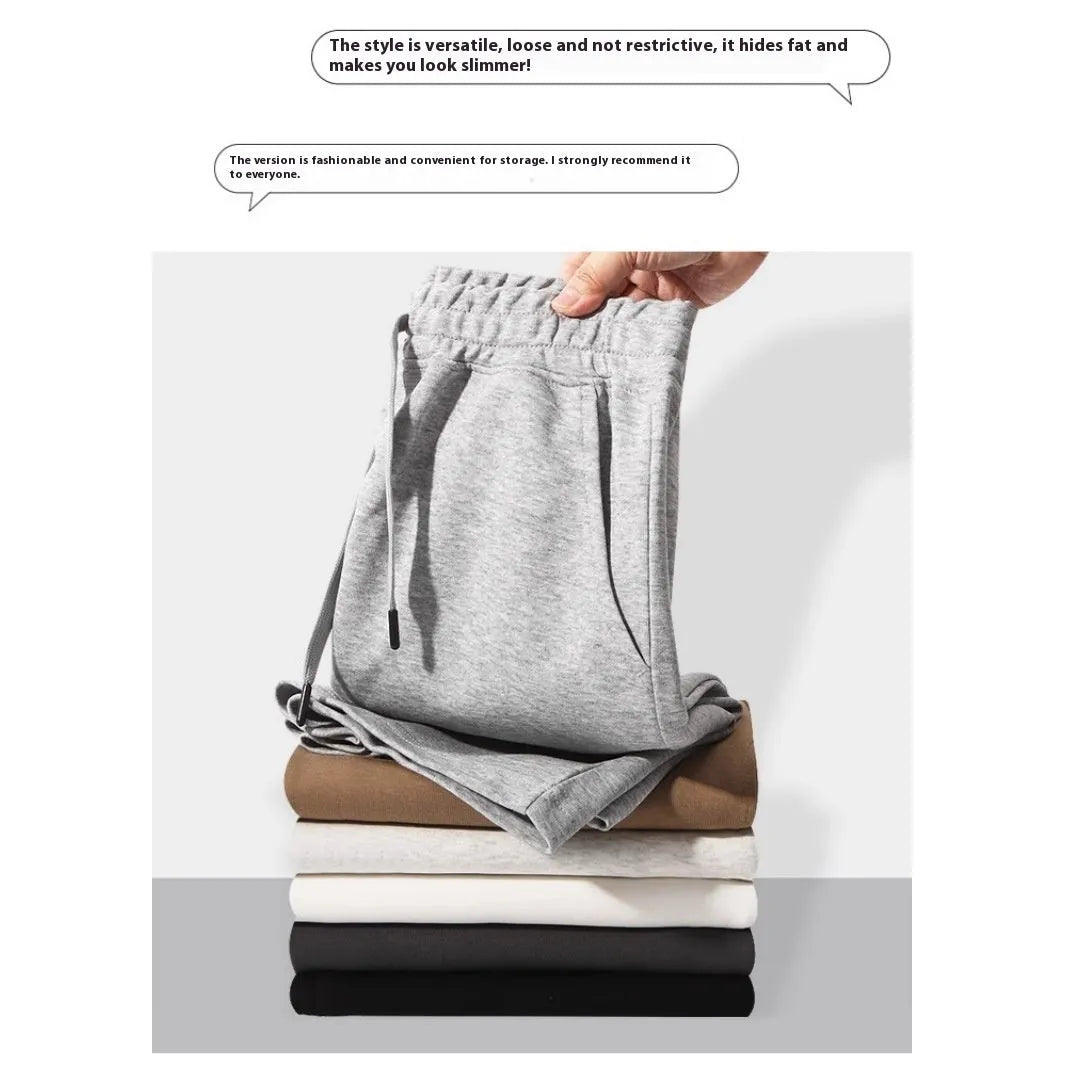 Men's straight leg cotton sports shorts in light grey on a hanger.