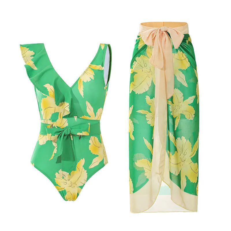 Women's solid colour one-piece swimsuit with spaghetti straps and an attached skirt.