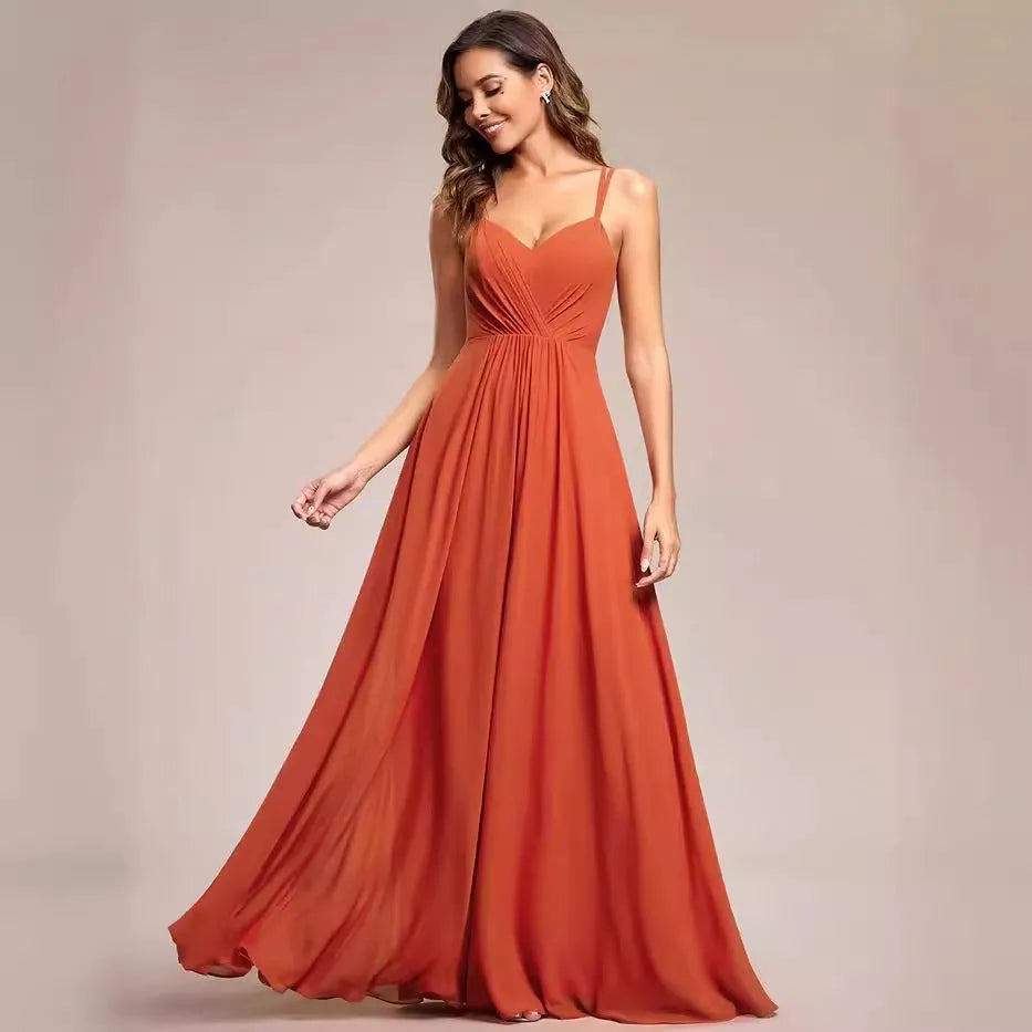A sleeveless light green women's dress with a pleated A-line long skirt on a mannequin.
