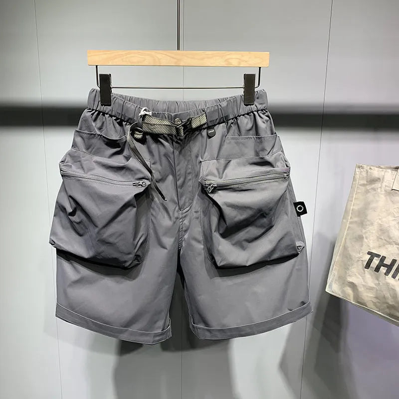 Men's black loose-fit workwear shorts with pockets in above-knee length