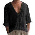 Men's washed cotton long sleeve V-neck t-shirt in solid colour on a neutral background