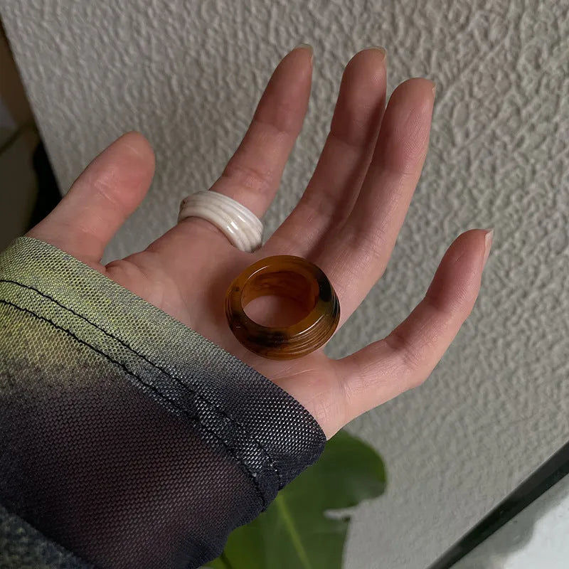 Resin ring with irregular geometric wide band design in brown and white colour options