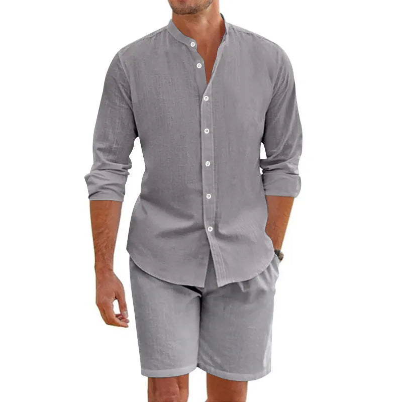 Men's dark grey short sleeve button-down shirt and matching drawstring shorts linen suit set laid flat.