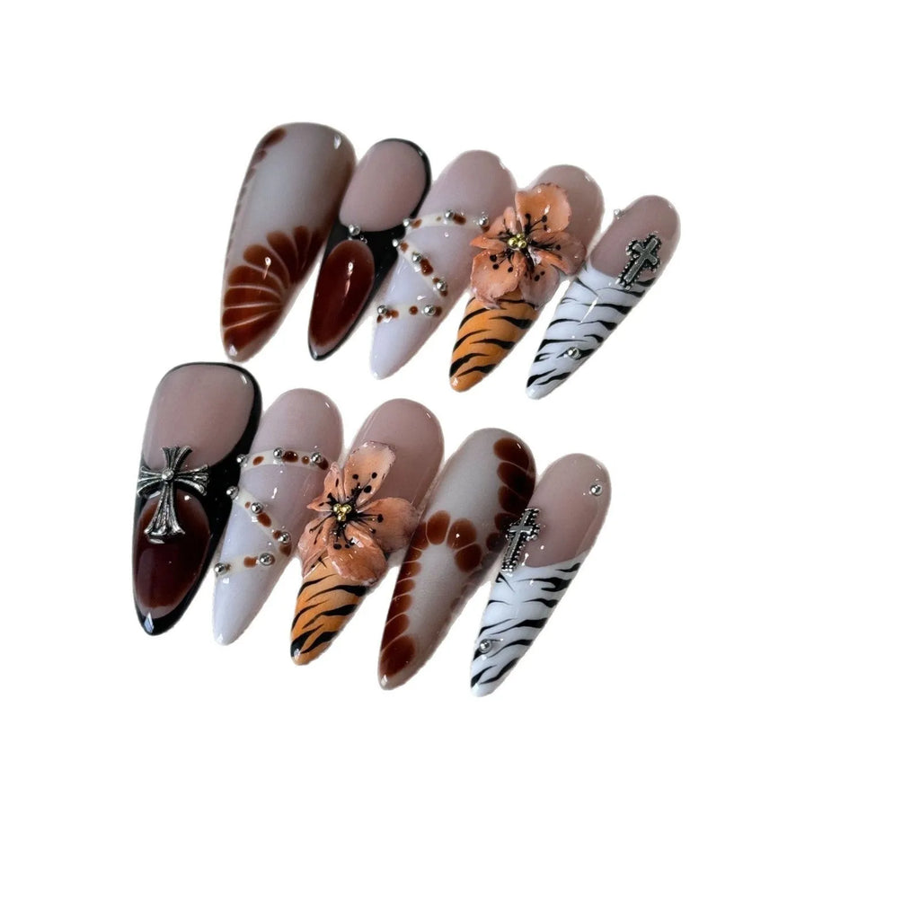Handmade French style gel nail art stickers with leopard, cross and floral prints in four sizes.