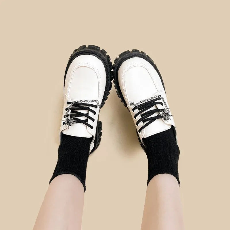 Women's Duke Asterism colour loafers with a metallic cross shoulder strap and round toe.