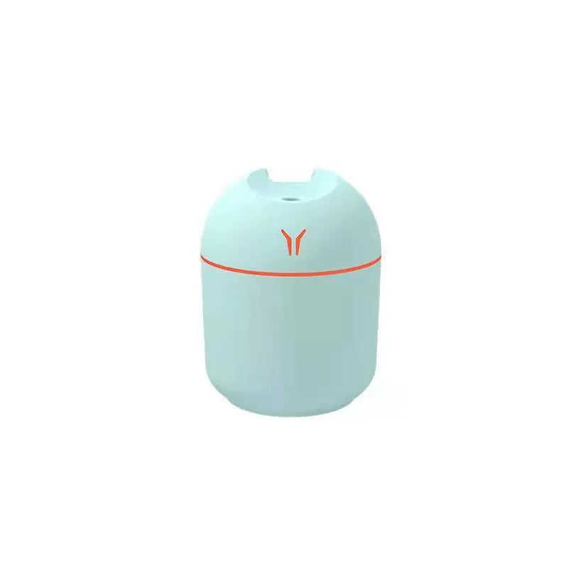 Round desktop humidifier diffuser in ivory white with USB cable connection and 250ml water tank capacity.