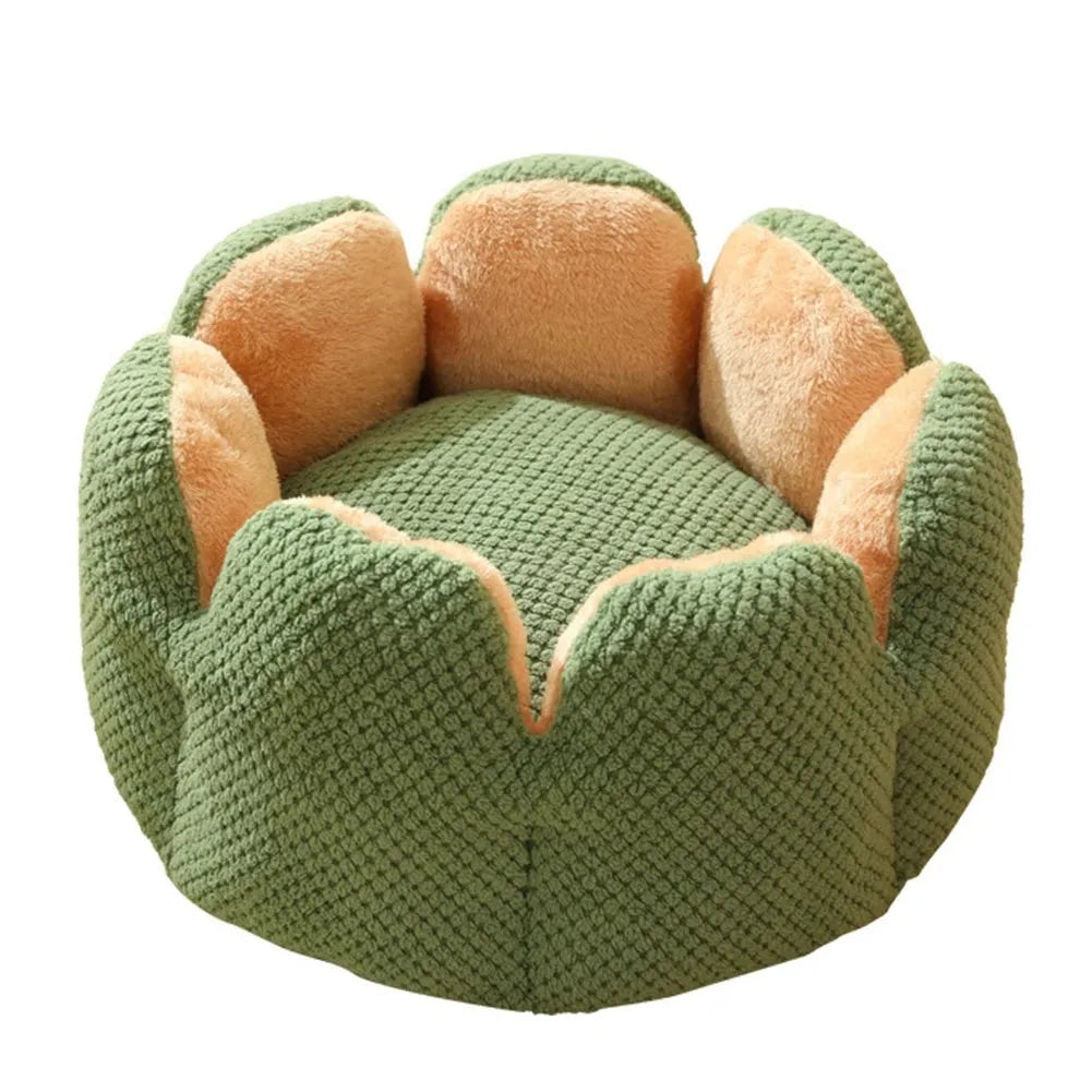 Grey petal-shaped plush kennel bed for cats and dogs on a hardwood floor.