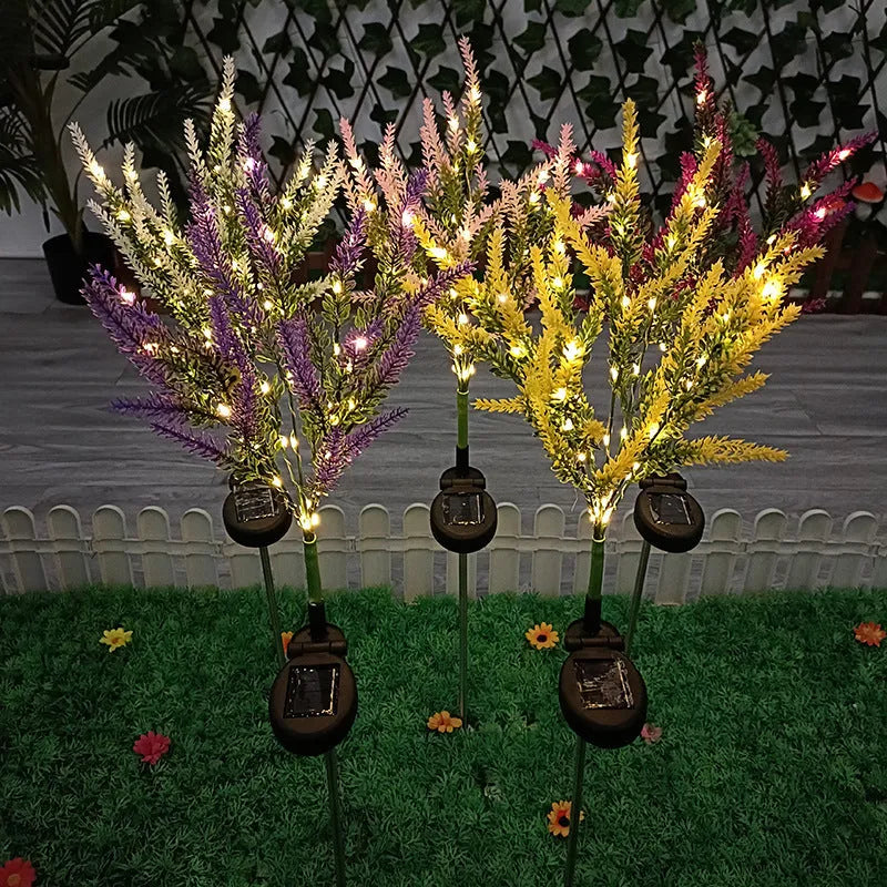 74cm tall solar-powered LED garden light with artificial flower design in lavender colour variations