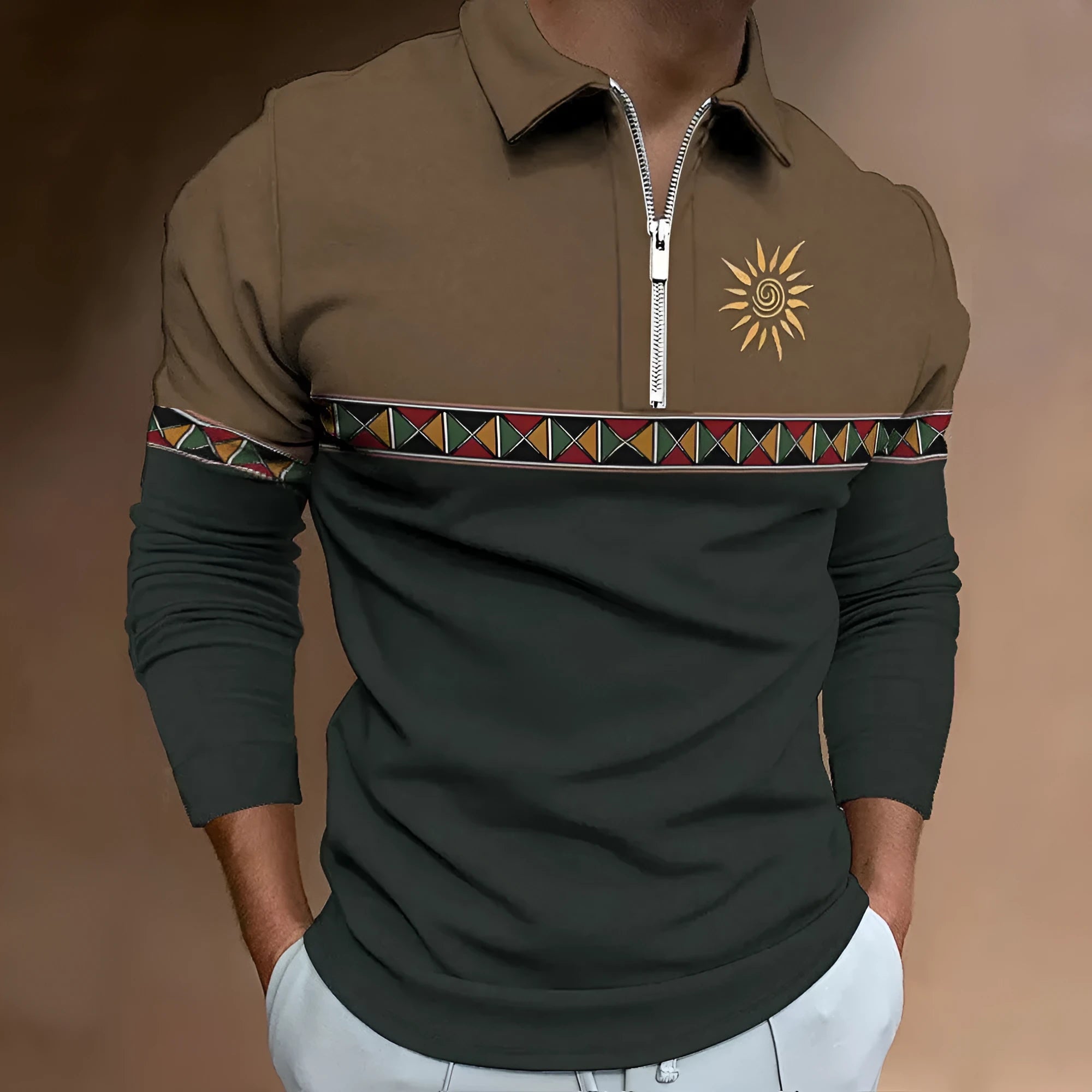 Man wearing a long-sleeved loose-fit striped top with retro colour printing and zipper details.