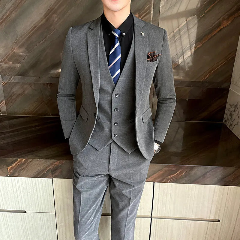 Men's slim fit British style business suit in black or dark grey cotton blend fabric