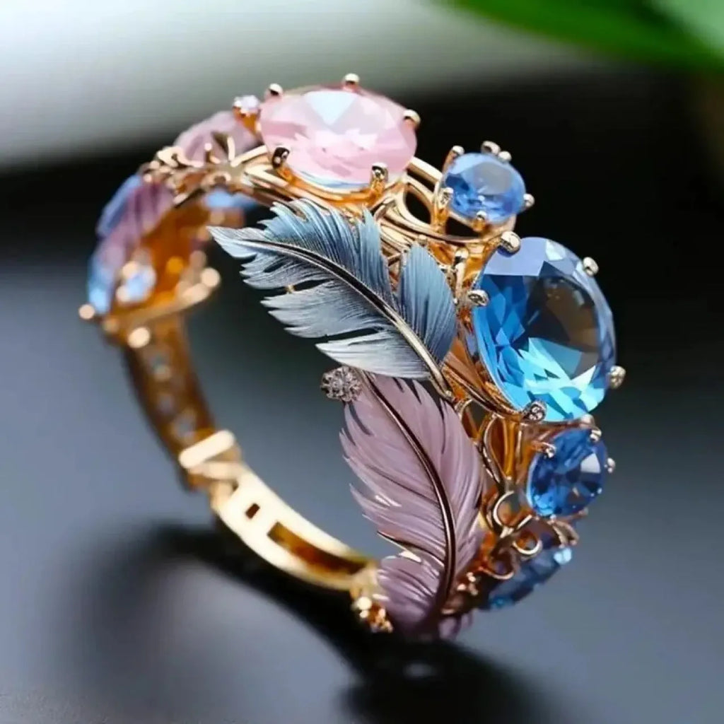 Gold colour brass feather ring with embossed geometric design and inlaid zircon details