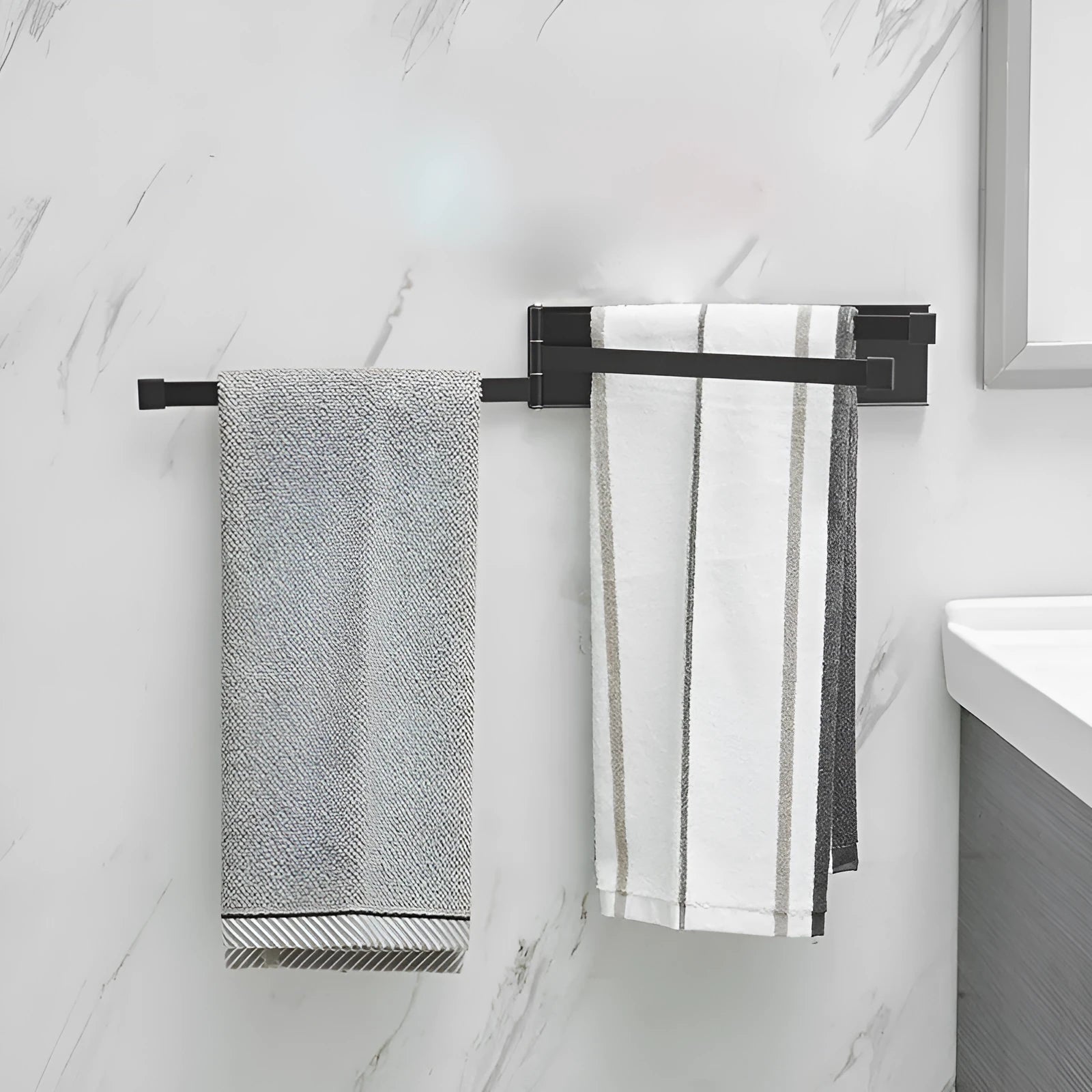 Nordic folding towel rack in carbon steel with black or white finish, mounted with adhesive without drilling