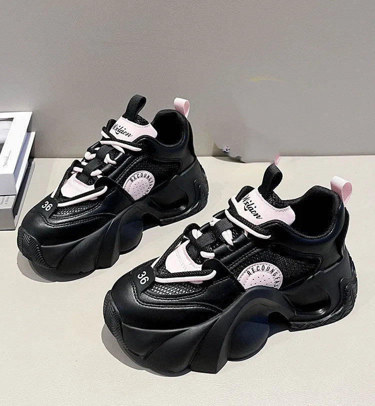 Women's pink casual sneakers with cross shoulder straps and a thick mid-heel sole.