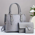 PU leather crossbody bag three-piece set showing bucket bag, wallet and card holder in coordinating colour