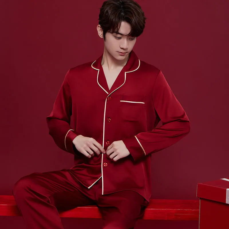 Red polyester wedding dowry suit set for a man and woman, featuring long sleeves and trousers.