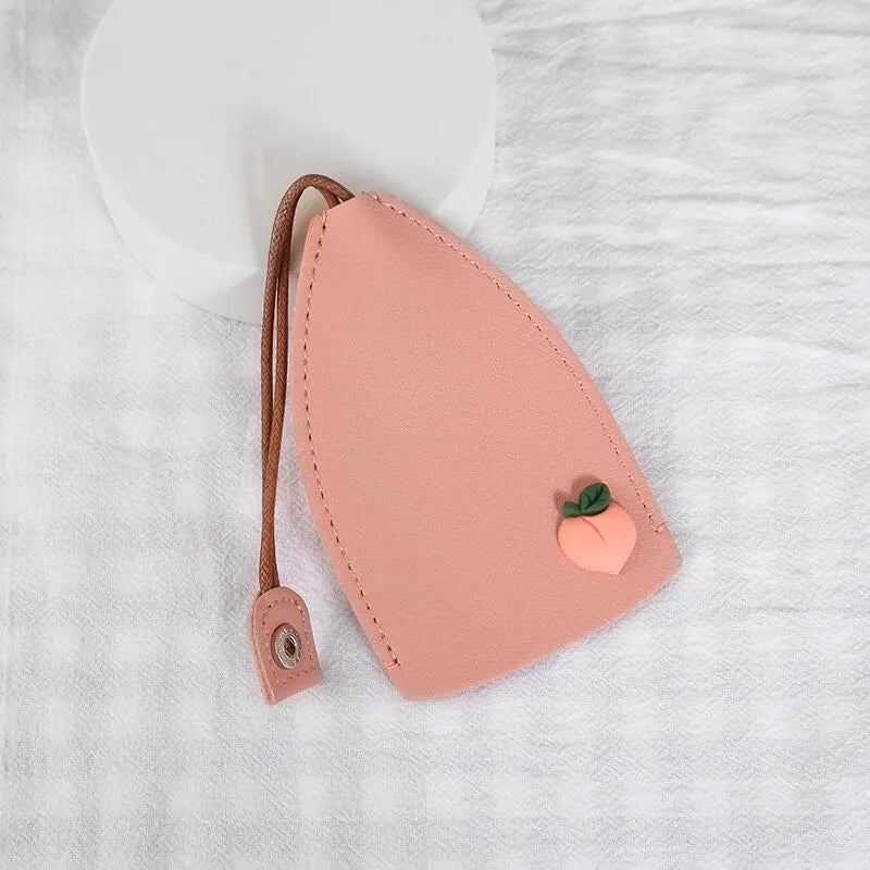 Colourful cartoon pull-out key case made from PU leather, showing the key extended from its protective sleeve.