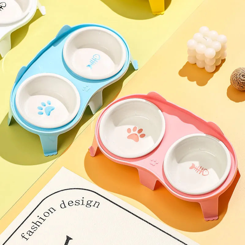 Ceramic cat food and water bowl set on elevated tilted stand with hook design