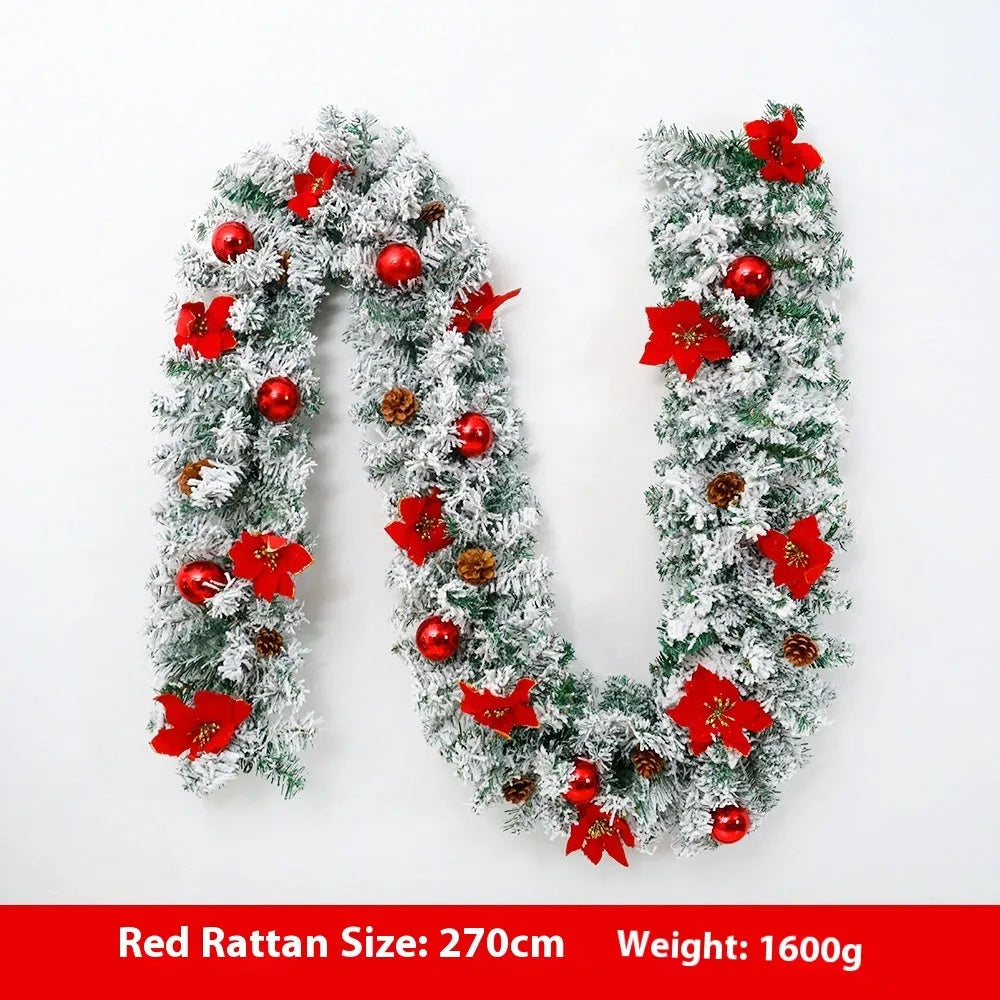 Flocked PVC rattan vine Christmas garland decoration in a festive colour, draped over a mantelpiece.