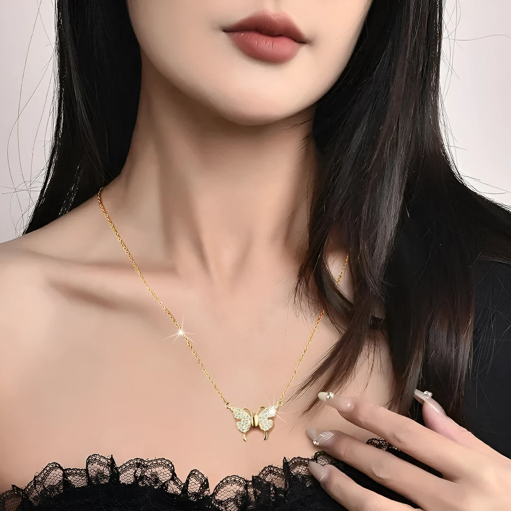 Gold titanium steel necklace with butterfly pendant on twisted chain and magnetic clasp.