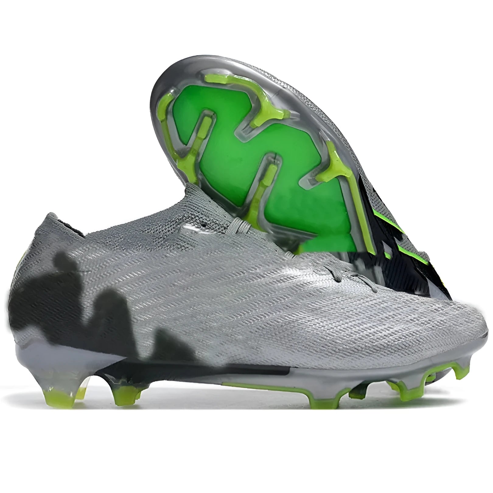 Men's low-top football shoes with knitted upper, lace-up front, and FG studs on rubber outsole.