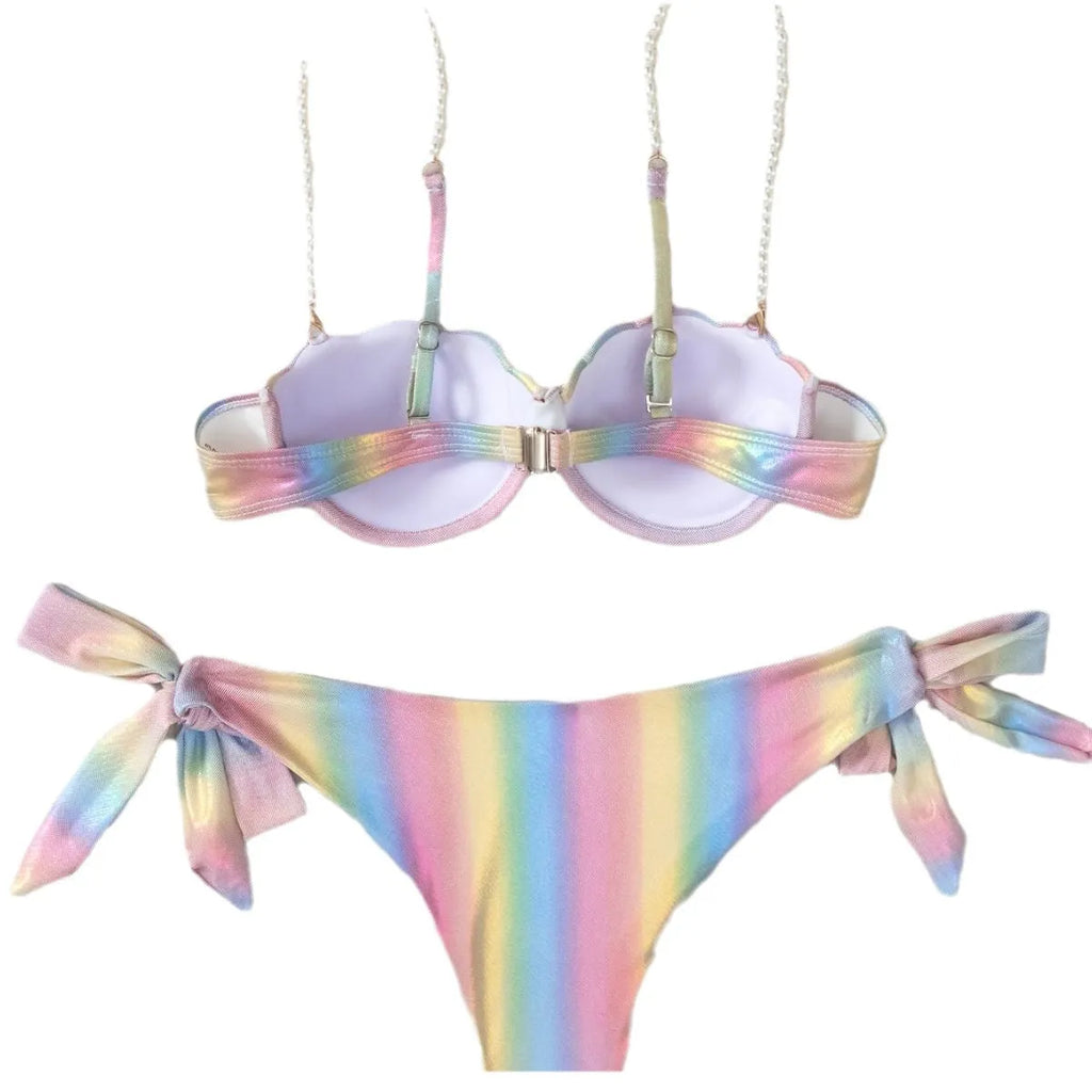 Women's shell rainbow print bikini swimsuit with split tied design on a beach background