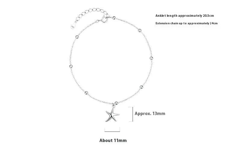 Close-up of a sterling silver anklet with a starfish charm on a round beaded chain.