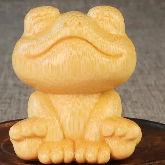 Solid bamboo smiling frog carving ornament measuring 5cm height for decorative gifts