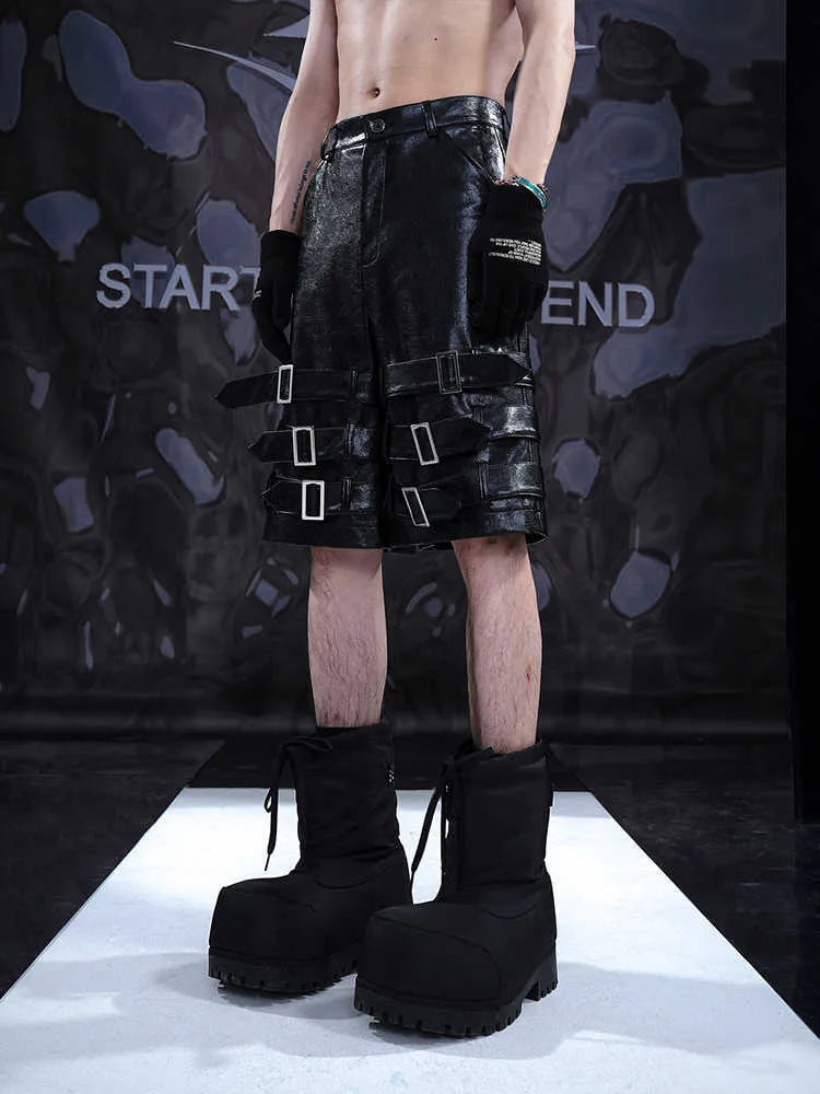 Men's black PU leather casual cropped shorts showing medium-low waist and polycarbaminate fibre material.