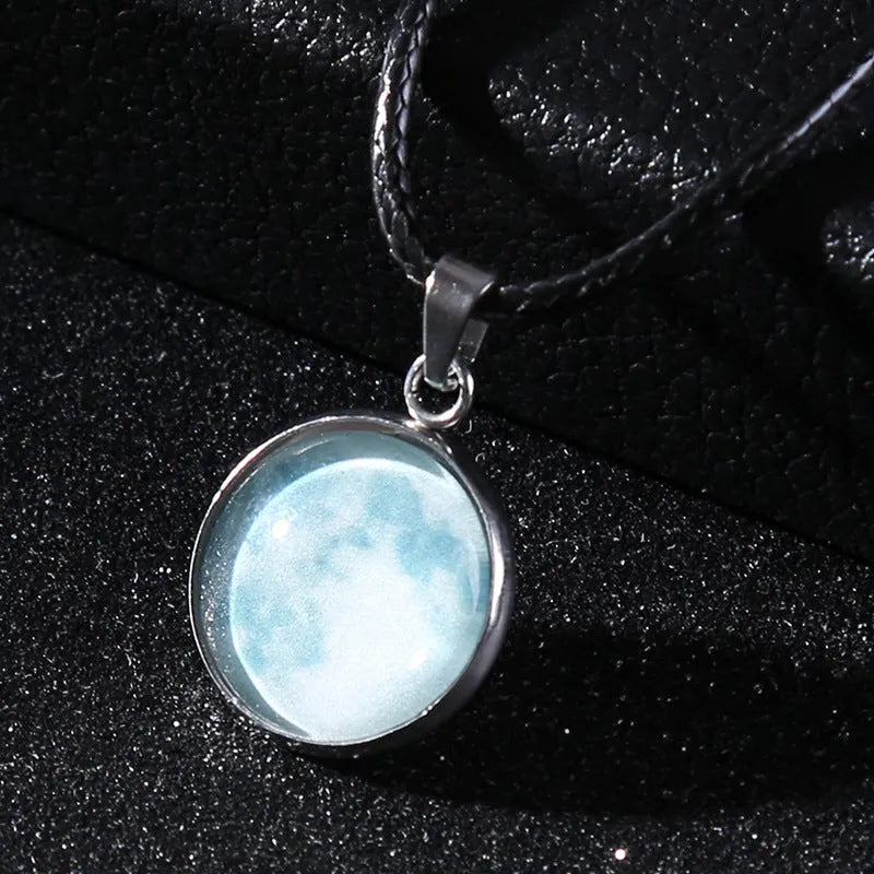 Luminous moon and constellation pendant necklace on a chain with an extension, shown in one of ten possible colours.