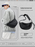 Men's nylon messenger backpack in black colour showing large capacity interior and lightweight construction