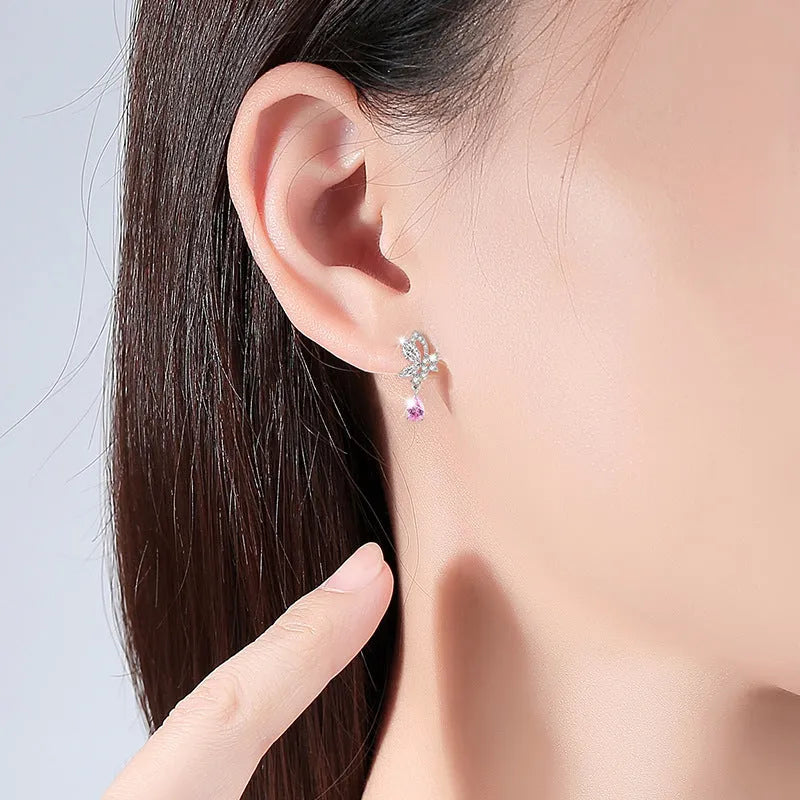 Butterfly crystal stud earrings in silver with decorative design