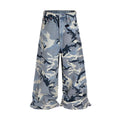 Snow camouflage blue loose-fit mid-waist jeans on a model, showing the camouflage pattern and trouser cut.