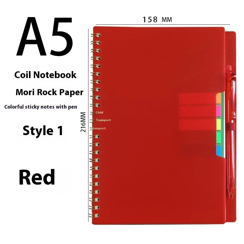 Erasable coil notebook with stone paper, showing a black cover option and a pen on a wooden desk.