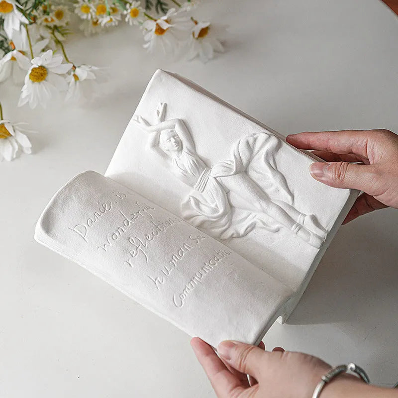 Glazed ceramic book stand in a modern simple style on a desk.