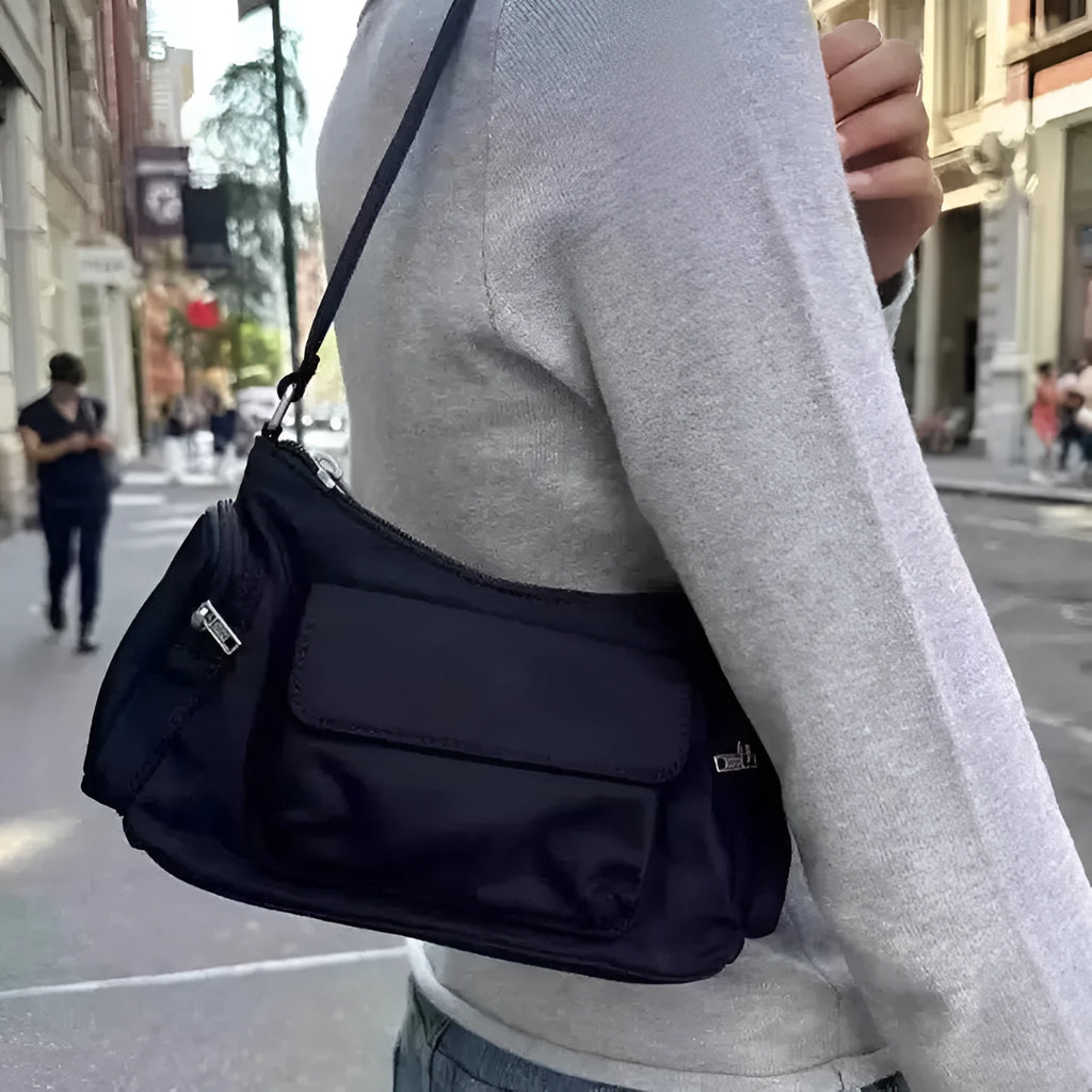 Black nylon unisex shoulder bag with double pockets and side line detail